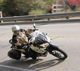 suzuki v strom 2011 review 2012 preview, The V Strom plays the role of sportbike quite well considering its tall stature Its top heavy looks belie its transitioning prowess