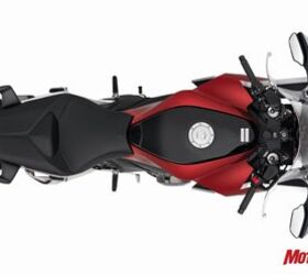 2010 honda vfr1200f revealed motorcycle com, Thanks to the crank layout the part of the motor that the rider straddles is nice and narrow that makes the seat seem lower and the whole bike seem small despite the fact it is several inches longer than the VFR800 Even the seat s got some new tech the cover is not a separate layer over padding it s molded right in