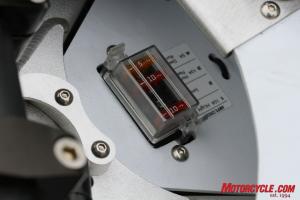 2010 electric motorcycle shootout motorcycle com, Their makers say they ve made them durable We re concerned about some of the exposed electrical connectors however and wonder if future gremlins may present themselves Zero S fuse panel shown