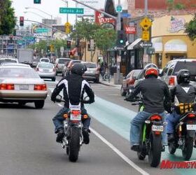 2010 electric motorcycle shootout motorcycle com, Yep that s us riding in the bicycle lane If the cagers get away with it we almost qualify Note how low my 6 foot frame right looks when cramped on the Native next to the 5 foot 8 inch guys on the taller bikes to the left