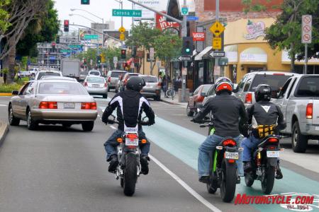 2010 electric motorcycle shootout motorcycle com, Yep that s us riding in the bicycle lane If the cagers get away with it we almost qualify Note how low my 6 foot frame right looks when cramped on the Native next to the 5 foot 8 inch guys on the taller bikes to the left