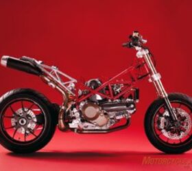 2007 ducati hypermotard 1100s motorcycle com, Stripped Hypermotard shows its minimalist engine with wheels design that demonstrates effective mass centralization