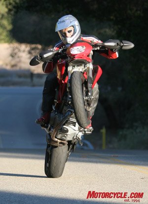 2007 ducati hypermotard 1100s motorcycle com, A grunty motor low gearing and a high center of gravity are perfect conspirators for mono wheel action