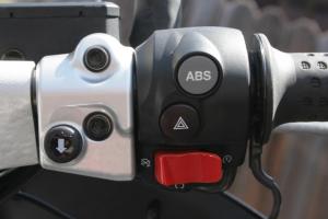 2011 moto guzzi norge 1200 gt 8v review motorcycle com, Here s a shot of the right side switchgear including the windshield lowering button placed way too far from a rider s thumb The left switchgear with the windshield up button is similarly affected