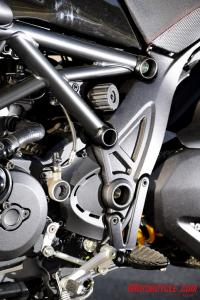 2011 ducati diavel review motorcycle com, A hand operated dial for adjusting shock preload peeks out from the trellis frame