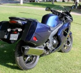2011 triumph sprint gt review motorcycle com, The new rear view of the Sprint includes a single exhaust in place of the triple trumpet found on the previous ST version
