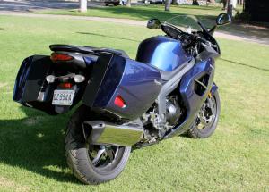 2011 triumph sprint gt review motorcycle com, The new rear view of the Sprint includes a single exhaust in place of the triple trumpet found on the previous ST version