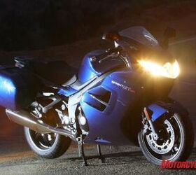 2011 triumph sprint gt review motorcycle com, Headlights are improved and look bright enough here We d still opt for aftermarket extra lighting if it were ours