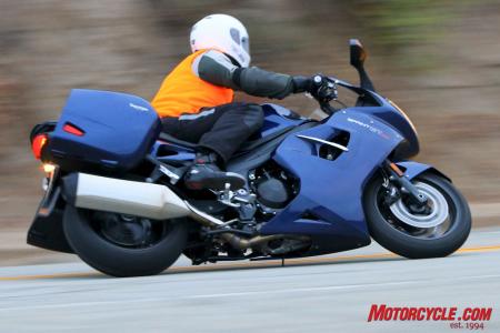2011 triumph sprint gt review motorcycle com, We loaded the bags to near their max recommended weight The bike falls into corners better with weight in it