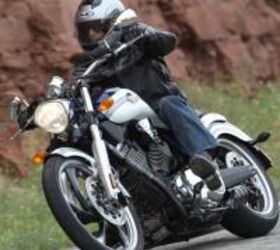 2011 victory lineup reviews motorcycle com, This two tone Vegas was fitted with accessory pegs and grips a Bandit seat and an accessory drag style handlebar placed further forward making U turns awkward
