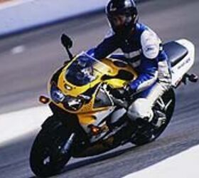 1998 honda cbr 900 rr motorcycle com, Intrepid reporter Billy Bartels hard at work on a 97 RR The boss forced him to take three Keith Code riding school classes one at the beautiful and tricky Laguna Seca Raceway then spend two days with Fast Freddie