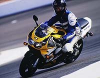 1998 honda cbr 900 rr motorcycle com, Intrepid reporter Billy Bartels hard at work on a 97 RR The boss forced him to take three Keith Code riding school classes one at the beautiful and tricky Laguna Seca Raceway then spend two days with Fast Freddie