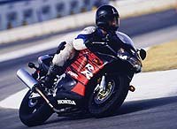 1998 honda cbr 900 rr motorcycle com, Here young Mr Bartels illustrates just how much a confidence inspiring mount like the 98 RR can change your riding Kinda looks like Mick Doohan there wouldn t you say