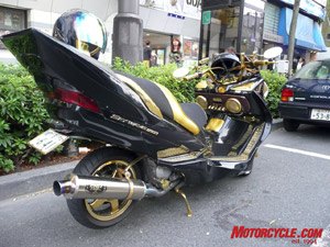 motorcycling in tokyo, Baby do you like to funk With that kind of artificial tail no there s wonder this modded 650 Suzuki Burgman needs a car s parking spot An ex Zen convent monk performed the fine job
