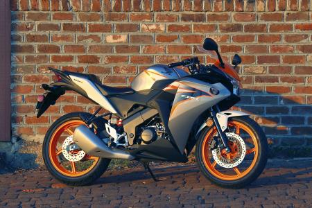 2011 honda cbr125r review motorcycle com, Honda updates the CBR125R for 2011 borrowing styling cues heavily from the firm s bigger sportbikes
