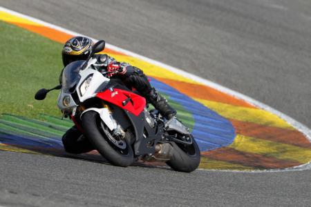 2012 bmw s1000rr review video motorcycle com, Picking a precise line is easy on the S1000RR
