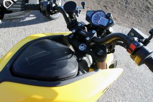 2013 brammo empulse r vs zero s zf11 4 video motorcycle com, The zippered storage compartment on the 2013 Zero S lacks security but is handy for carrying anything from burgers and fries to prescriptions Note the optional smartphone bracket
