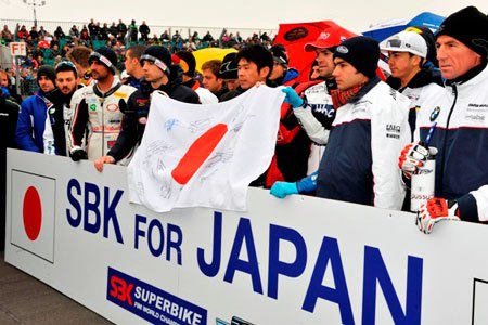 wsbk 2011 donington park results, Racers and teams lined up together to show their support for Japan Noriyuki Haga holds a Japanese flag signed by all riders which will be auctioned to raise money for the Red Cross