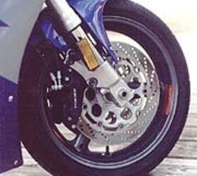 open superbikes 1997 motorcycle com, Upside down forks and six piston brakes combined to make the GSXR our most stable and hardest stopping racetrack weapon