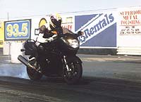 open superbikes 1997 motorcycle com, Shawn Higbee puts some heat into the XX s tire before its 10 20 run at 136 1 mph