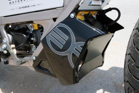 2011 zero xu review video motorcycle com, Each Zero motorcycle is equipped with an onboard charger like this one Its location at the bottom of the frame doesn t affect handling
