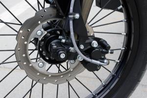 2011 zero xu review video motorcycle com, A single disc and twin piston caliper up front are plenty to slow the XU A steel braided line is a nice touch