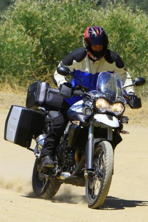 best motorcycles of 2012 motorcycle com, Unpaved roads are no impediment for the Tiger 800XC It s plenty capable in the dirt and happily burns up paved roads adding up to a great do it all motorcycle ready for whatever adventure lies over the horizon
