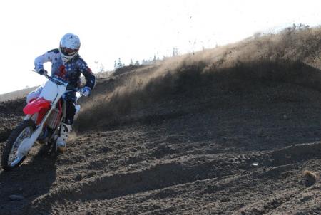 2013 honda crf450r review motorcycle com, Pomeroy digging up roost thanks to improved cornering manners