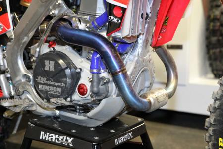 inside the 2013 supercross works bikes motorcycle com, The exhaust pipe on Chad Reed s Honda is extremely exposed but engineers couldn t figure out any other place to add length to the exhaust which ultimately provides power that is robust yet controllable