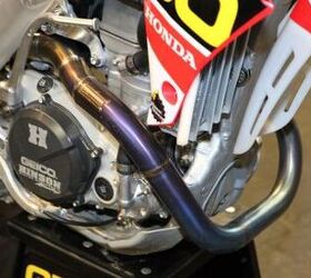 inside the 2013 supercross works bikes motorcycle com, The exhaust on Windham s Honda CRF450R doesn t use a canister like Chad Reed s full works bike Notice the difference between the two setups when you go back and compare photos