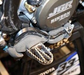 inside the 2013 supercross works bikes motorcycle com, Baggett s mechanic prefers to run fine coarse foam under the brake pedal to make sure nothing interferes with its action