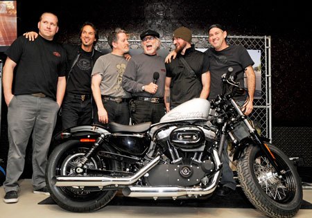 2010 harley davidson forty eight unveiled, Willie G Davidson with the mic and the Harley Davidson Design team of Casey Ketterhagen Frank Savage Ray Drea Rich Christoph and Paul Martin stand with the Forty Eight at its media preview at the Ace Hotel in New York City