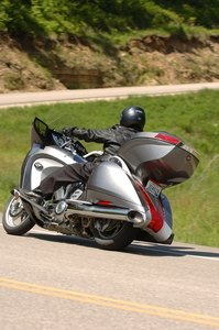 2008 victory vision first ride motorcycle com, The Victory Vision Tour has the capacious tail trunk that augments the swoopy but not huge saddlebags The 1000 cheaper Vision Street goes without the hatchback