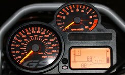 2010 ducati multistrada 1200 vs bmw r1200gs motorcycle com, The Beemer s panel is almost rudimentary next to the Ducati s However at a glance the GS analog gauges require less brain processing power