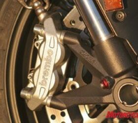 2008 ducati 848 road test motorcycle com, Two piece Brembo calipers are radially mounted to the inverted Showa fork Though lower spec items compared to the 1098 s monobloc design they provide plenty of power without a harsh initial bite