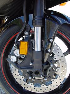 2005 yamaha r6 intro motorcycle com, Yamaha equips the 05 R6 with 41mm upside down forks radial mount calipers a Brembo radial pump master cylinder lighter rotors and Dunlop D218 tires