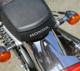 2013 honda cb1100 review motorcycle com, The CB11 hearkens back to a bygone era Note the seat emblem megaphone pipe bullet turn signals