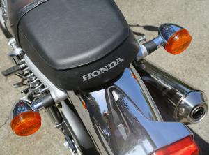 2013 honda cb1100 review motorcycle com, The CB11 hearkens back to a bygone era Note the seat emblem megaphone pipe bullet turn signals