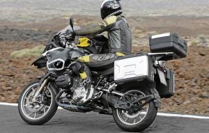 2013 bmw r1250gs preview motorcycle com, GS spotters will notice the shaft drive switching sides with the exhaust s muffler Note also the altered intake and exhaust routing from new cylinder heads