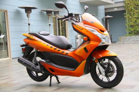 2011 honda pcx review motorcycle com, Aiming at youthful buyers the contemporary looking PCX 125 will be on tour this summer