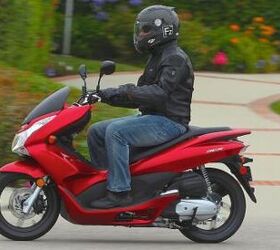 2011 honda pcx review motorcycle com, Modern flowing lines give the PCX an up to date appearance