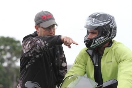 lee parks total control advanced riding clinic review, Lee Parks explains to me something I did wrong in one of the many parking lot exercises we did That happened a lot I tried not to argue too much and just played grasshopper and let sensei teach me the way to motorcycling enlightenment