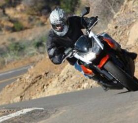 2010 streetfighter shootout kawasaki z1000 vs triumph speed triple motorcycle com, The Z1000 retained its excellent composure even when pushed hard