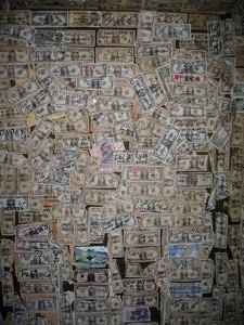 2005 oatman arizona tour, Inside the Oatman Hotel Restaurant Visitors are encouraged to write their name and home town on a dollar bill and tack it on the wall Locals estimate that over 20 000 bills cover the walls and ceiling