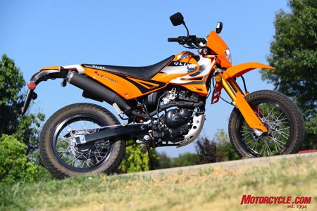2009 honda crf230m vs 2009 qlink xf200 motorcycle com, What the QLINK suffers in quality it attempts to make up for with styling In some instances the Chinese really get motorcycles cause whether most of us will admit it or not looks mean a lot in motorcycling