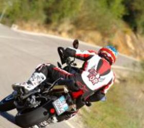 2011 aprilia dorsoduro 1200 review first impressions motorcycle com, Despite its heft the Dorsoduro handles corners with great agility