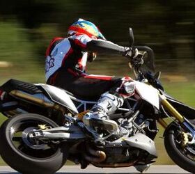 2011 aprilia dorsoduro 1200 review first impressions motorcycle com, Rider aids like traction control can help less experienced riders grow with the bike