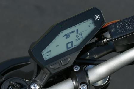 new 2014 yamaha fz 09 yz450f yz250f motorcycle com, The LCD instrument cluster is offset right of center for no purpose other than styling The readout area is tidy but small and includes a fuel gauge and gear position indicator