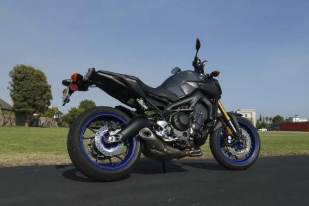 new 2014 yamaha fz 09 yz450f yz250f motorcycle com, The 2014 FZ 09 comes in two colors Rapid Red or Liquid Graphite Expect them in dealers sometime this fall