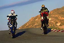 2001 open class shootout motorcycle com, Freddie Spencer School Instructor Jeff Haney and MO s Brent Minime Avis standing fully erect admiring each other s package